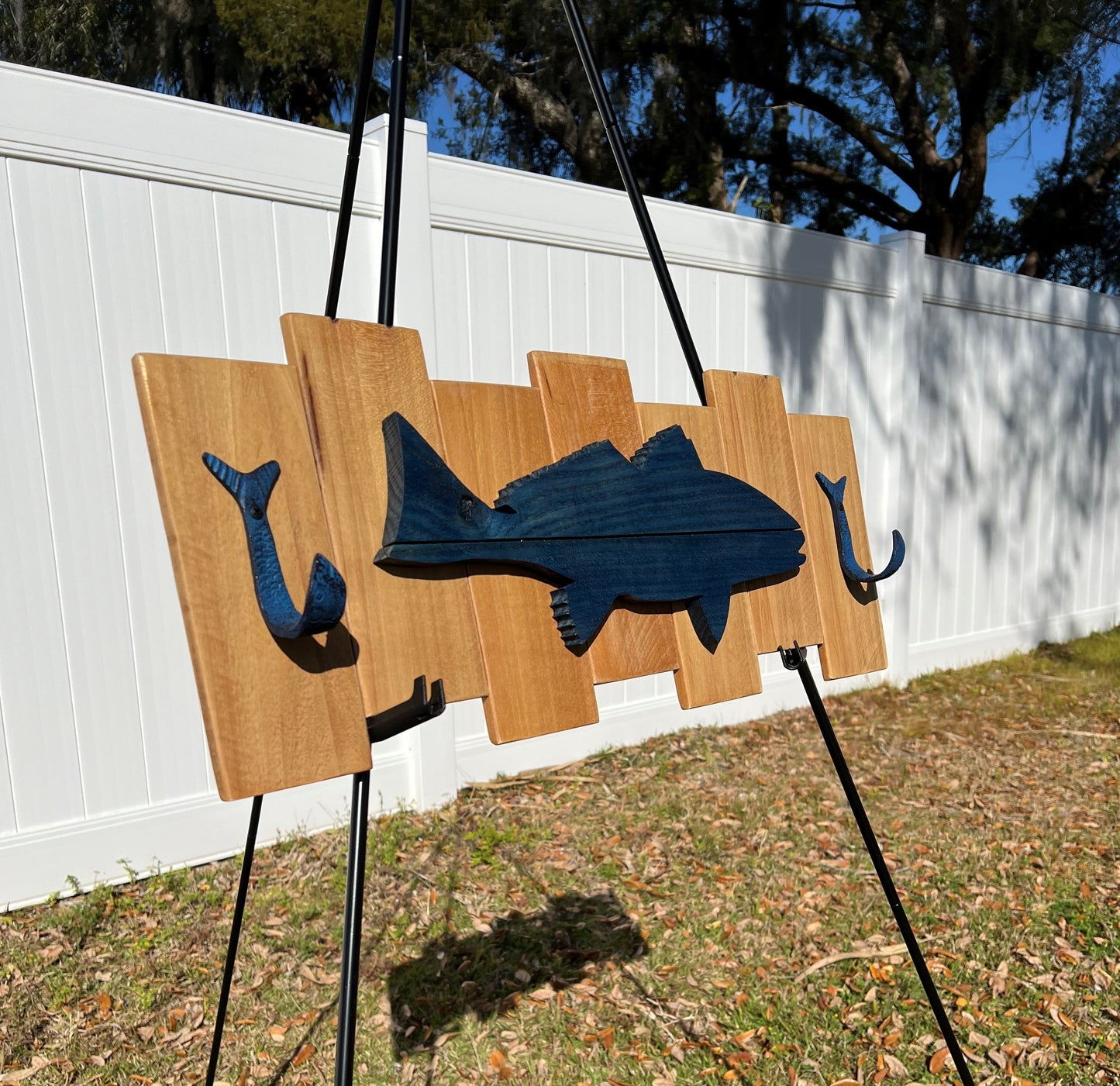 Indigo Blue colored Red Fish pallet sign with 2 flippin fish coat hooks. 10-1/4"H x 26-1/8"W x 2-1/2"D