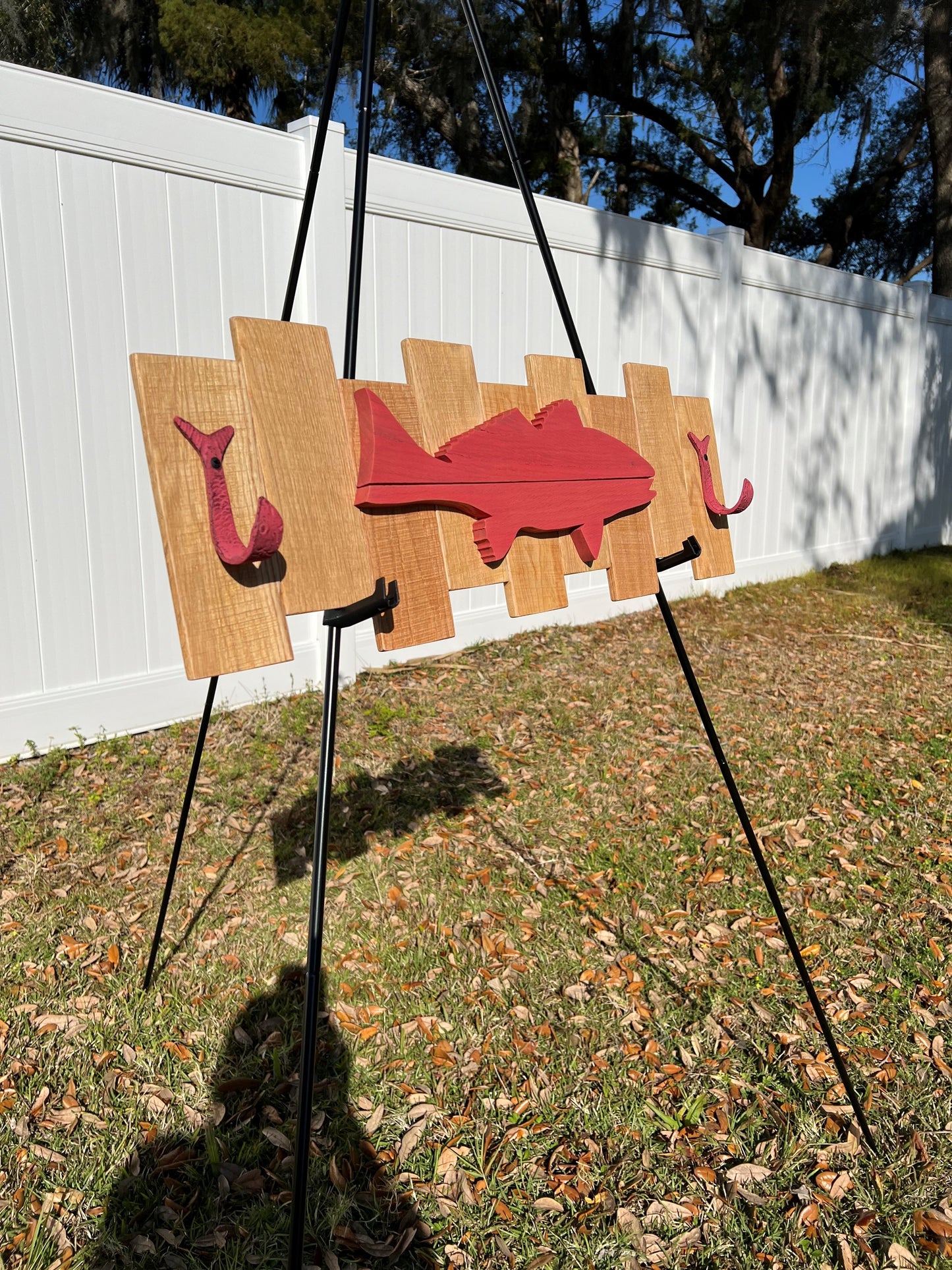 Coral colored Red Fish pallet sign with 2 fish coat hooks - 9-7/8"H x 29-3/8"W x 2-1/2"D.