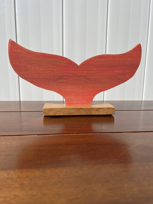 Coral Whale Tail Statue on oak base.